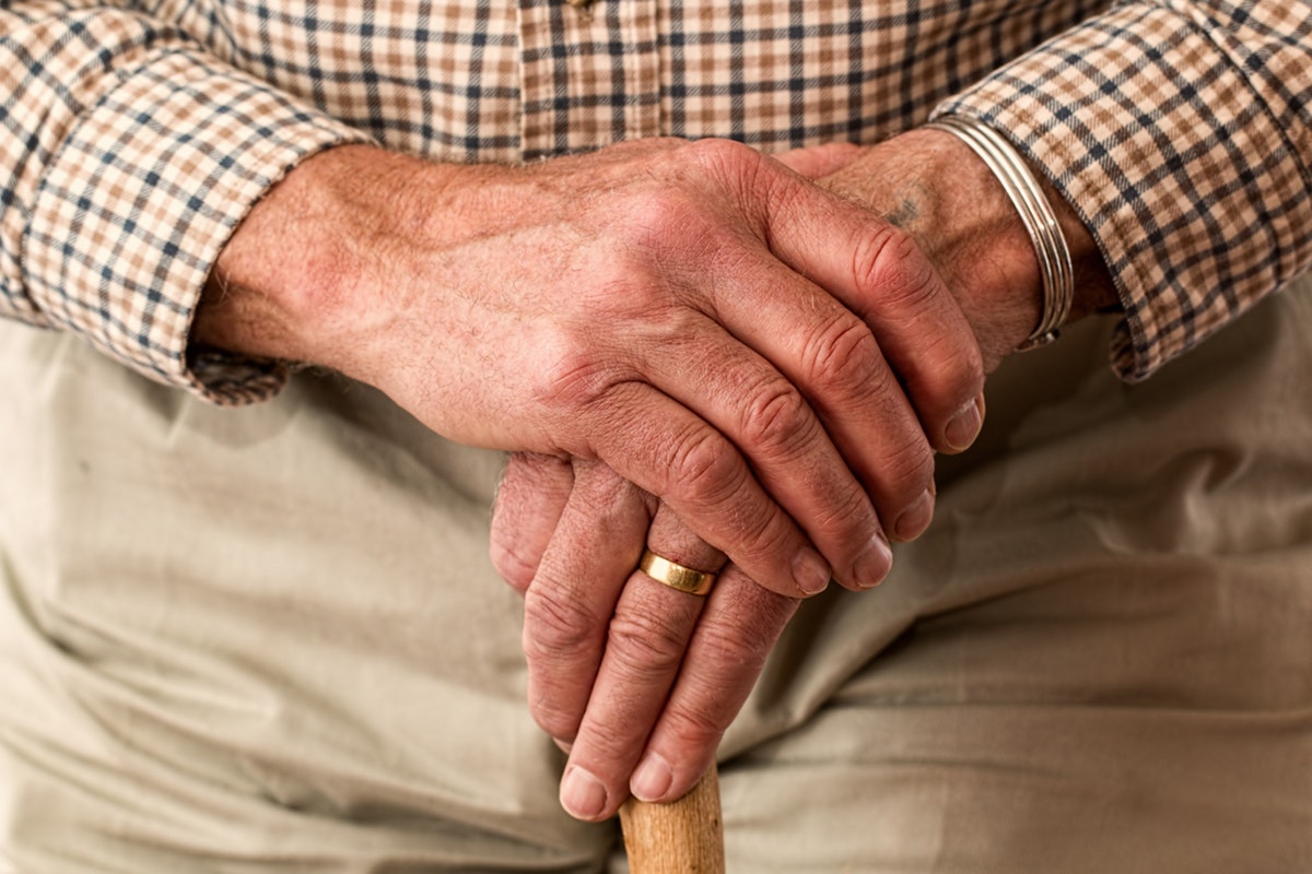 Senior hands of a man showing sign of arthritis